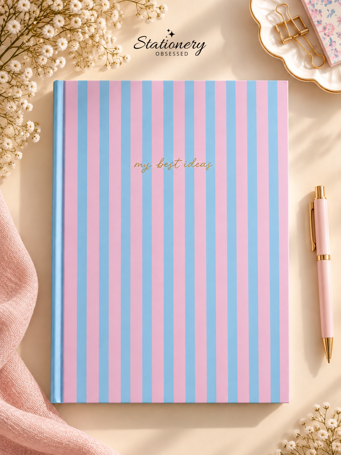 A4 pink and blue striped hardback lined notebook with ‘my best ideas’ script on the cover.